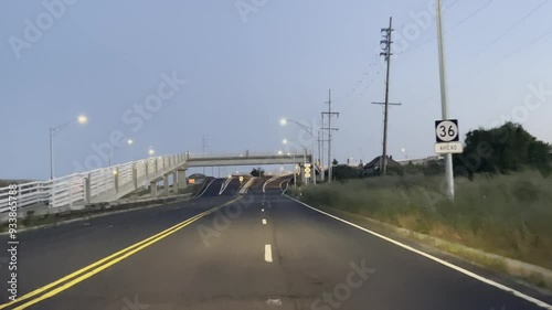 Driving out of Sandy Hook, New Jersey during twilight on a summer night in August, 2024 photo