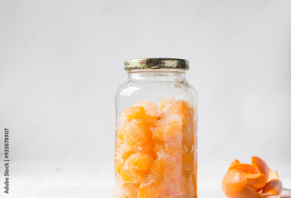 tangerine cheong in a glass jar on a white background, korean tangerine cheong in a transparent jar, tangerine in sugar syrup, process of making tangerine cheong tangerine cheong in a glass jar on a white background, korean tangerine cheong in a transparent jar, tangerine in sugar syrup, process of making tangerine cheong