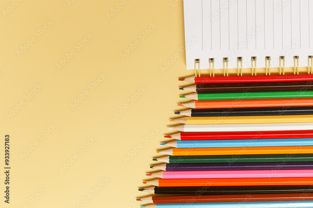 Fototapeta premium Back to school concept with variety of office and school supplies on yellow background. 