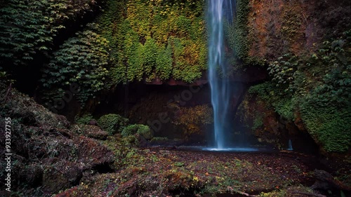 Travel people explore beautiful Bali destination waterfall Pucak Manik hidden in tropical rainforest jungle on nature background Bali, Indonesia 4K photo