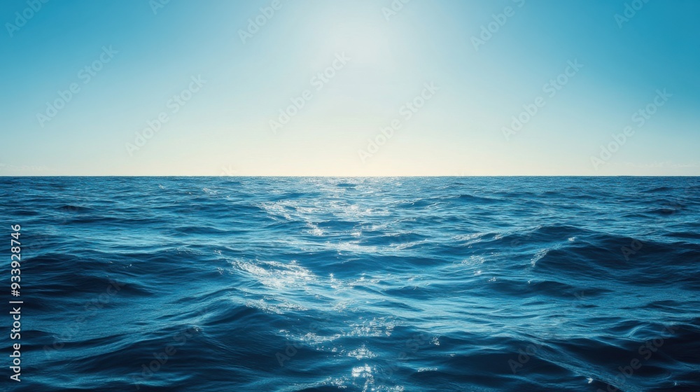 Fototapeta premium A serene view of the open ocean with calm waves and clear blue skies.