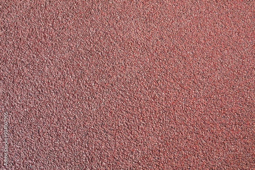 Stone background. Red asphalt. Surface for cycle paths.