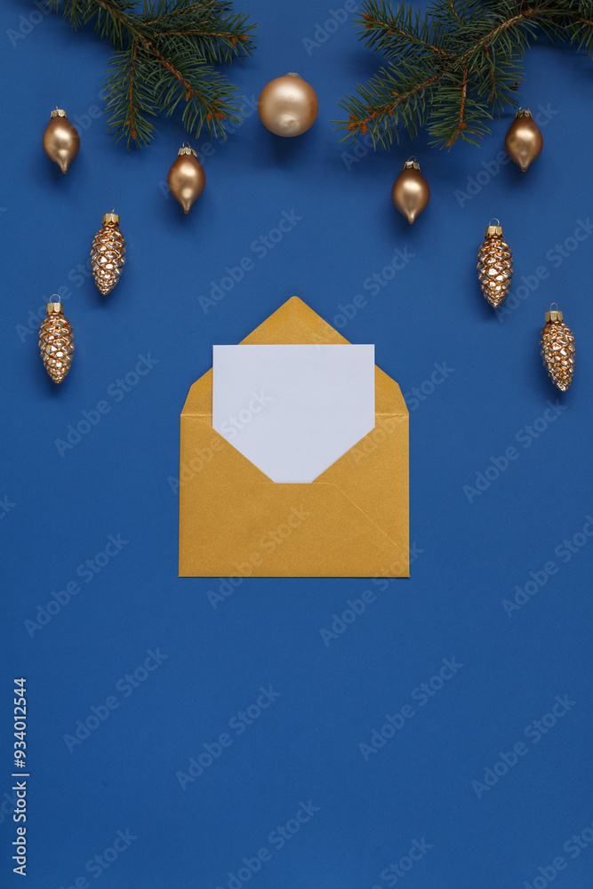 A golden envelope with a blank card inside is placed on a vibrant blue background. A golden envelope with a blank card inside is placed on a vibrant blue background.