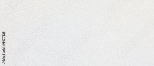 A close-up of a white, textured surface with a minimalistic style, providing a clean and neutral ambiance.