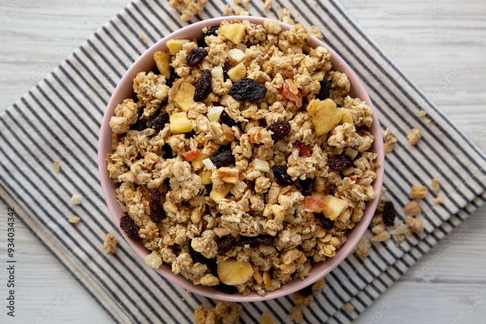 Healthy Homemade Muesli with Fruits in a Pink Bowl, top view. Copy space. Healthy Homemade Muesli with Fruits in a Pink Bowl, top view. Copy space.