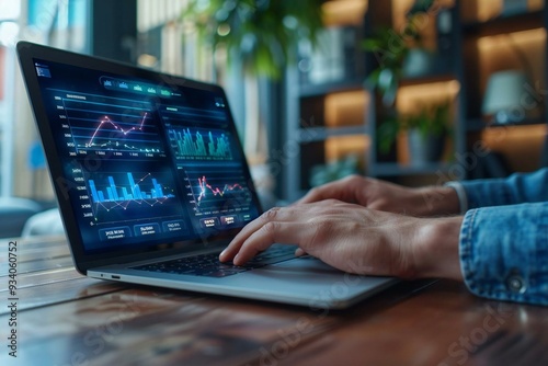 photo of a businessman or data scientist working on a laptop with a business dashboard analytics chart displaying metrics KPI, analyzing performance and creating insight reports