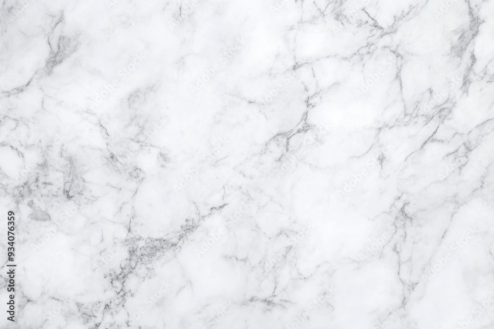 A high-resolution image of white marble texture with natural veining. A high-resolution image of white marble texture with natural veining.