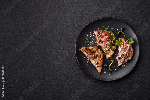 Variation of several toasts or bruschetta with prosciutto, mushrooms and veal