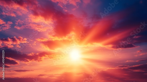 Intense sun rays glowing through a vibrant sunset sky with a mixture of fiery reds and soft purples,