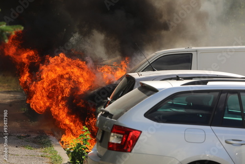 Cars are burning in front of a residential building in the Nadezhda neighborhood of Sofia, Bulgaria