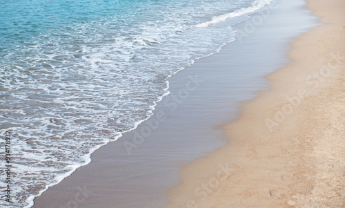 Fototapeta Naklejka Na Ścianę i Meble -  Soft wave of blue sea on sandy beach.