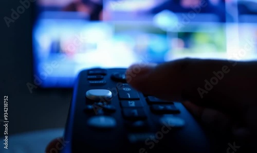 Extreme Close-Up of a Hand on TV Remote for Streaming Service