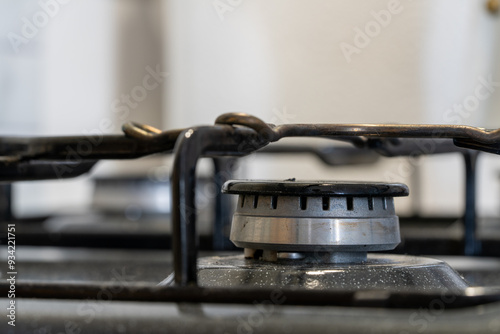A moka pot on a gas stove, brewing coffee traditionally over an intense blue flame, with controlled heat from the gas stove. Gas ignition and various stages of the flame burning. 