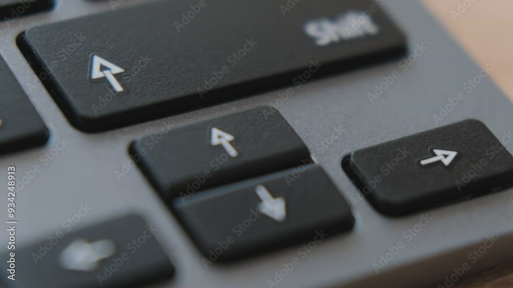 A detailed look at arrow keys on a keyboard, illustrating their function for moving up, down, left, and right during navigation. A detailed look at arrow keys on a keyboard, illustrating their function for moving up, down, left, and right during navigation.