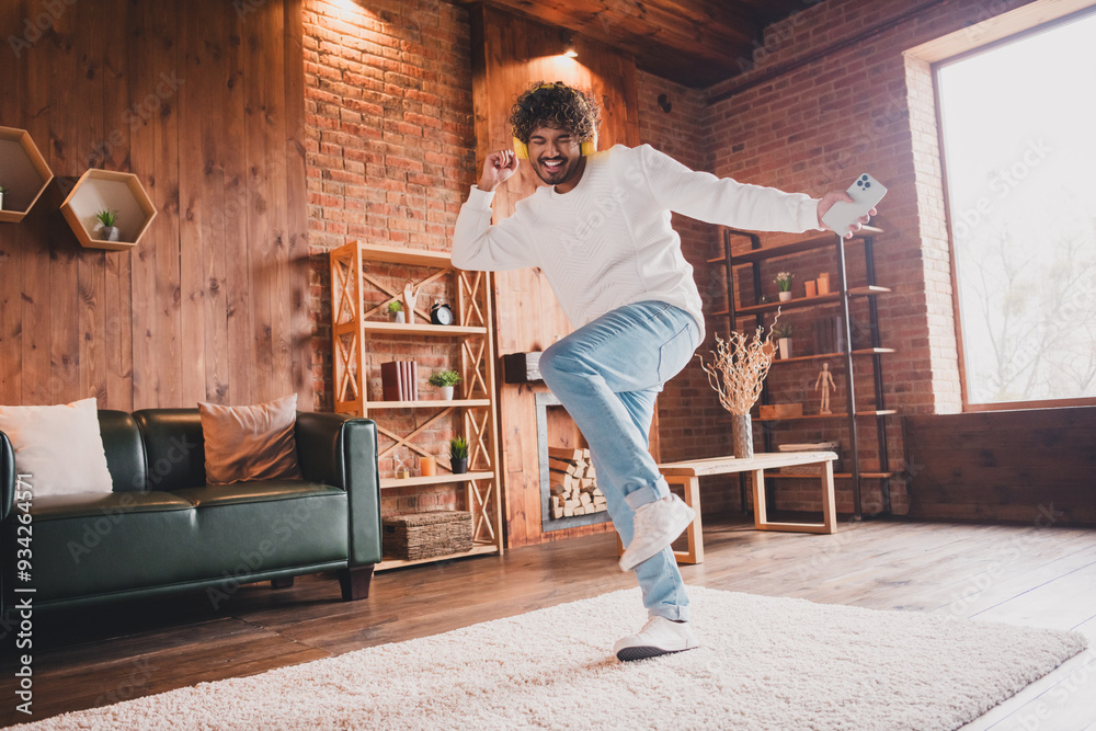 Fototapeta premium Photo of funky cool guy dressed white pullover headphones relaxing home having fun indoors house apartment room