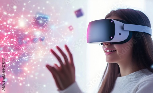 Young woman experiencing virtual reality with digital elements in a bright in...