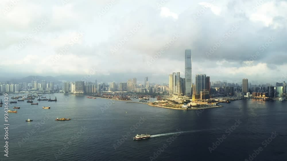 Drone, ocean and boat with skyscraper in city of Hong Kong with clouds, building and architecture landscape. Aerial view, city background and cloudy view with water transportation, scenery and town Drone, ocean and boat with skyscraper in city of Hong Kong with clouds, building and architecture landscape. Aerial view, city background and cloudy view with water transportation, scenery and town