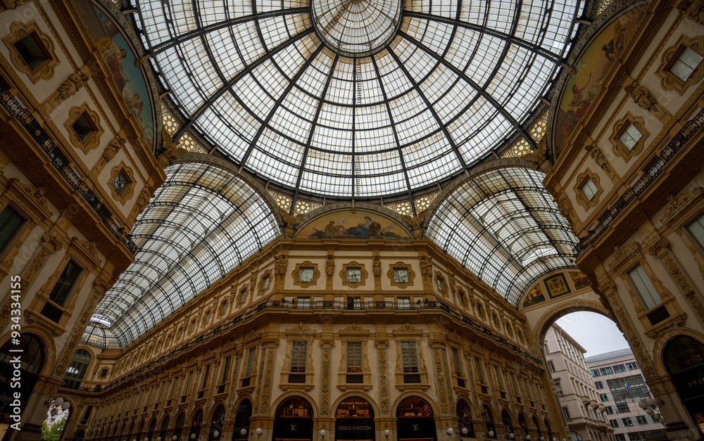 Milan, Italy - June 07, 2024: Milan mall. Glass dome of Galleria Vittorio Emanuele. Milan, Italy - June 07, 2024: Milan mall. Glass dome of Galleria Vittorio Emanuele.