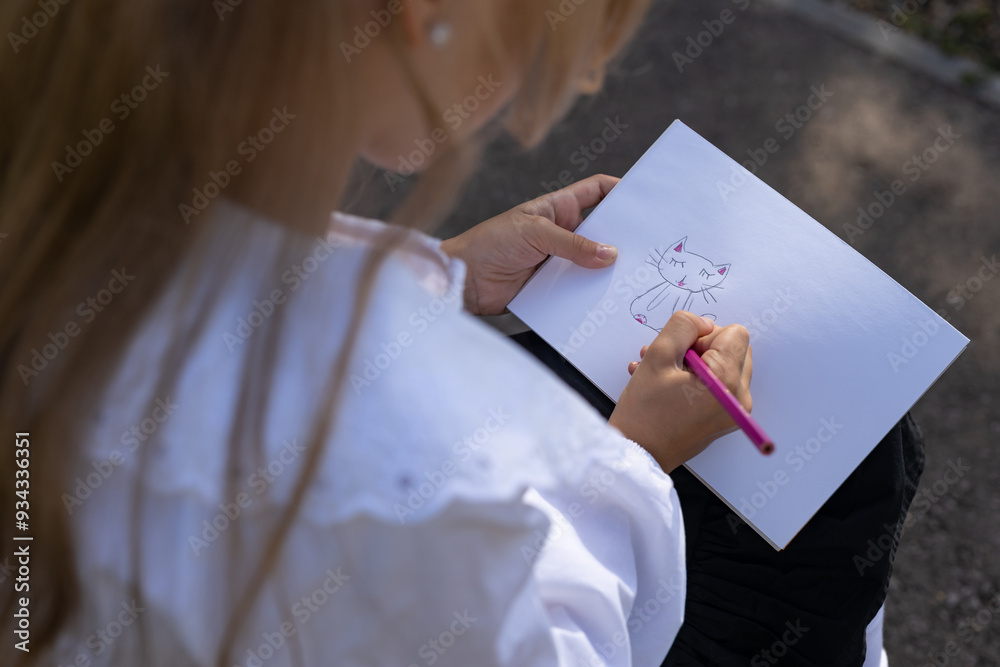 girls are happy to draw their imaginations and paint with crayons in their spare time at home during school holidays girls are happy to draw their imaginations and paint with crayons in their spare time at home during school holidays