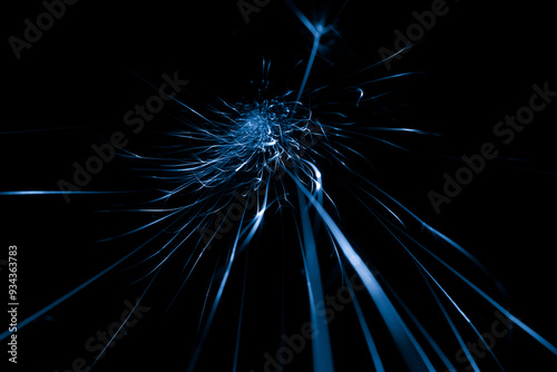 blue sparks from the grinder glowing in the dark
