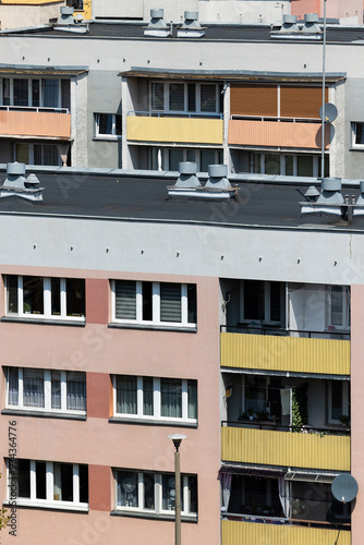 Facades of multi-family residential blocks with balconies. Photo taken on a sunny day.