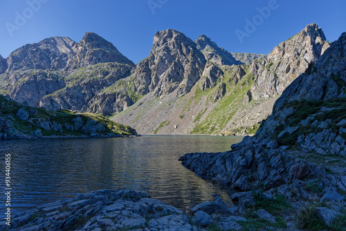 Lac du Crozet rocky shoreline in the French Alps at dawn