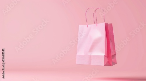 pink shopping bag floating in the air on a pastel