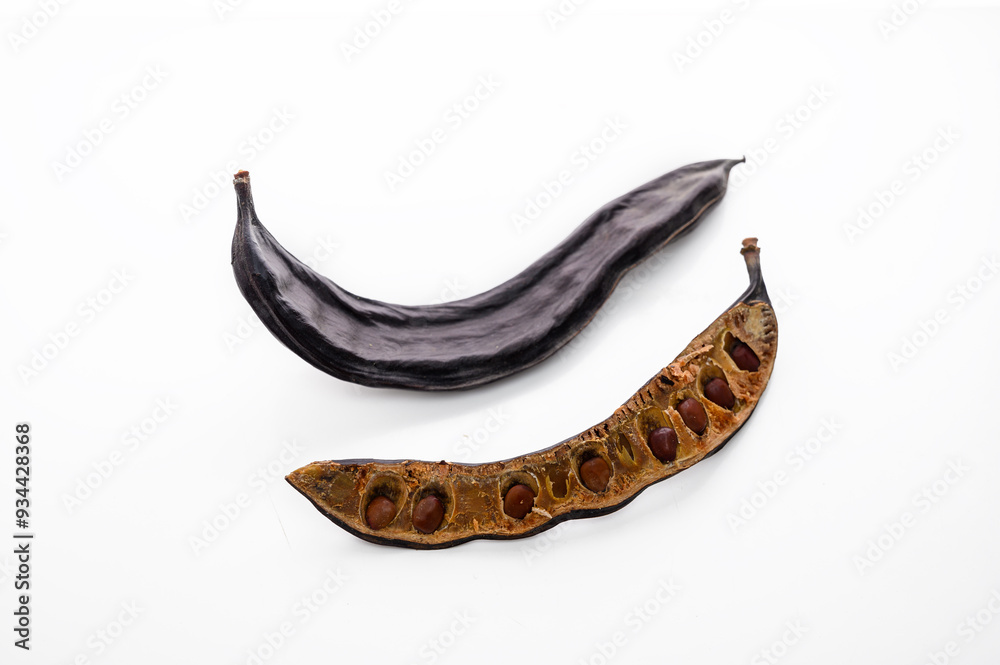 Carob carob fruit and seeds on white background. Isolate. Carob carob fruit and seeds on white background. Isolate.