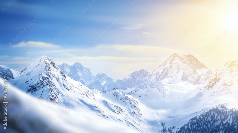 Fototapeta premium Majestic mountain range with snow-capped peaks and clear blue sky above. Majestic Mountain Range