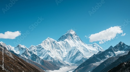 Majestic mountain range with snow-capped peaks and clear blue sky above. Majestic Mountain Range