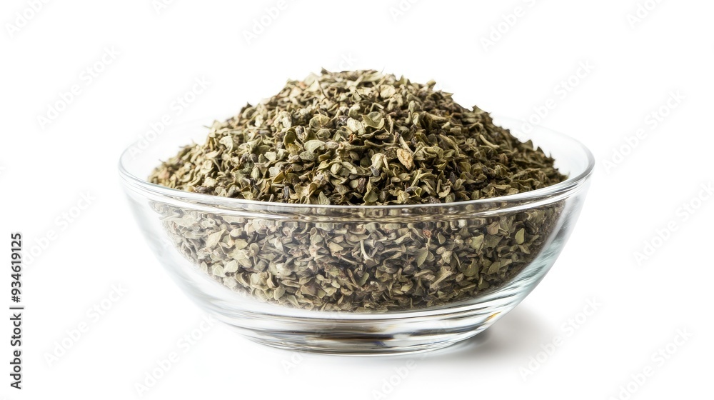 A transparent glass bowl filled with dried oregano seasoning, isolated on white, with the rich texture of the herb contrasting against the clean background. A transparent glass bowl filled with dried oregano seasoning, isolated on white, with the rich texture of the herb contrasting against the clean background.