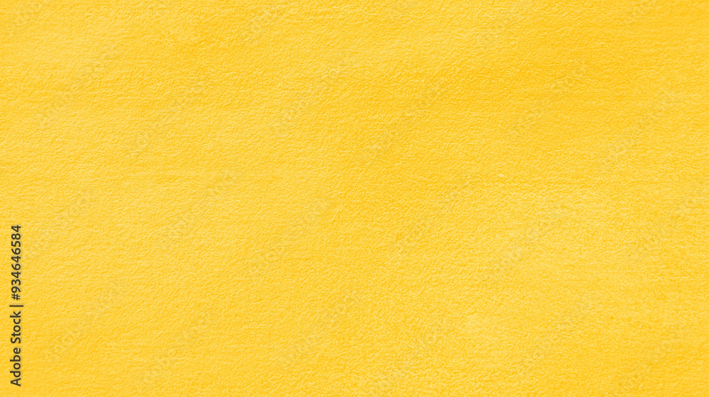 a seamless texture of slightly textured colored paper in golden yellow color a seamless texture of slightly textured colored paper in golden yellow color