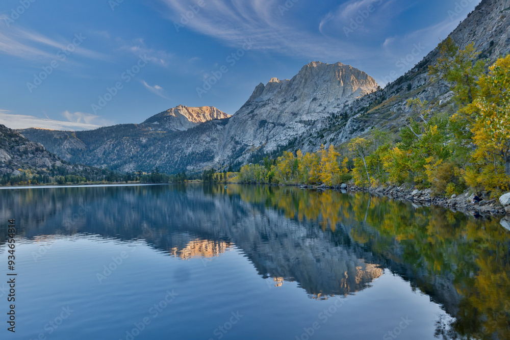 USA, California, June Lake. Aspen in Fall golden color evening light reflected in lake USA, California, June Lake. Aspen in Fall golden color evening light reflected in lake