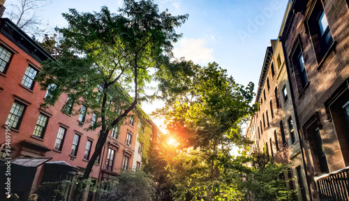 Obraz na płótnie Tree lined block of historic apartment buildings on 10th Street in the Greenwich Village neighborhood of New York City w salonie