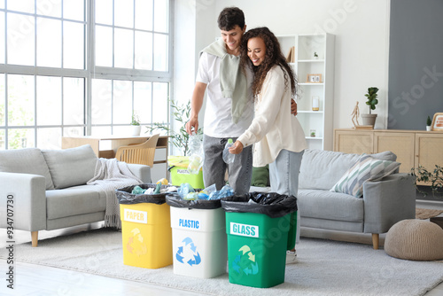 Young couple sorting househ...