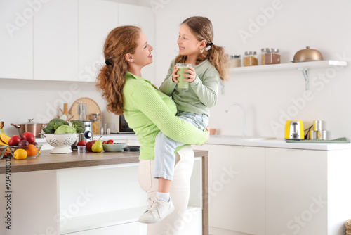Little daughter in mother's...