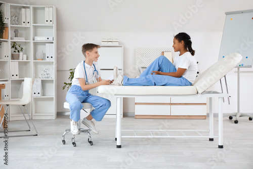 Teenage doctor consulting A...