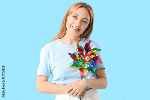 Mature woman with toy windm...