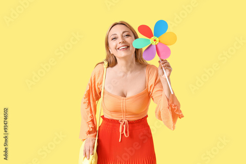 Mature woman with toy windm...