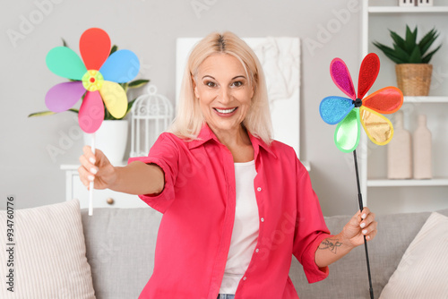 Mature woman with toy windm...