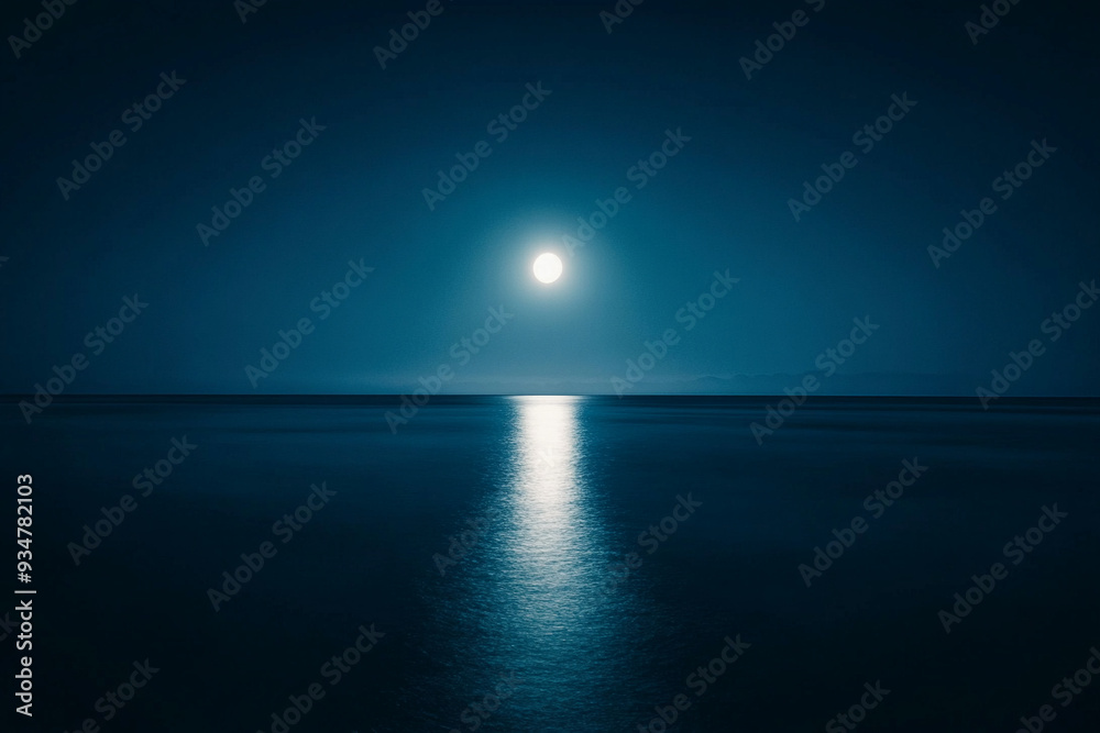 Fototapeta premium A calm night by the sea with the moon casting
