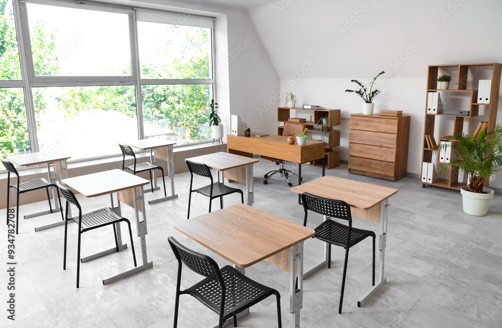 Interior of stylish empty classroom with chairs and desk Interior of stylish empty classroom with chairs and desk