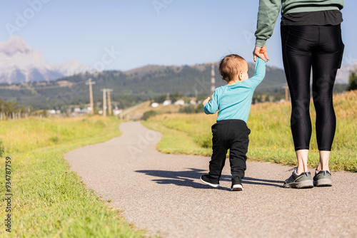 Parent and Child Walking Together in Crowsnest Pass, Alberta photo