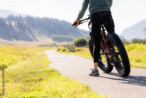 Cyclist Riding On Scenic Path In Crowsnest Pass, Alberta photo