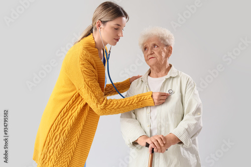 Nurse with stethoscope list...