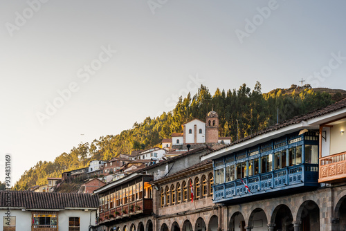 Typical balconies and the Church of San Cristobal in Cusco Peru at sunset