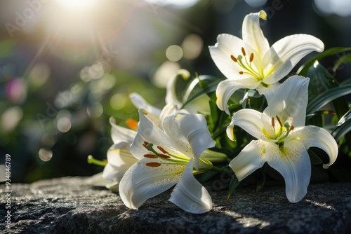 White Lilies on Polished Tombstone with Copy Space for Compassionate Message, Serene Remembrance photo