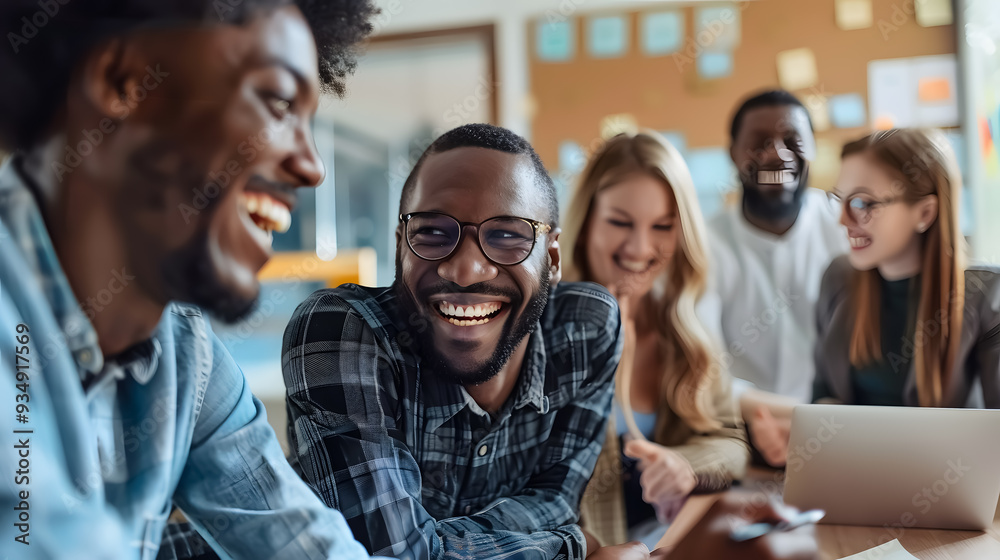 A casual meeting of a diverse business team, smiling and analyzing financial data. A casual meeting of a diverse business team, smiling and analyzing financial data.