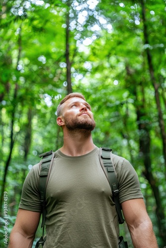 Serene Exploration - Man in Olive T-shirt Hiking Through Lush Forest with Sunlight Filtering Through Tall Trees, generative Ai