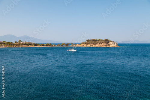 Small White Sailboat in a Coastal Bay - Aerial View